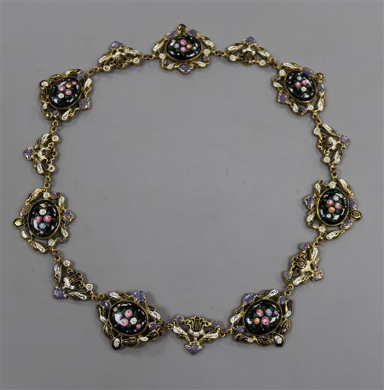 A continental gilt metal and enamel necklace, 43cm.